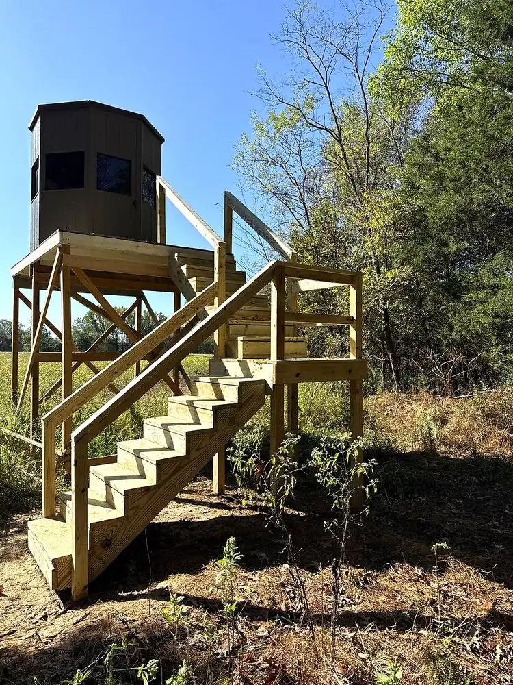 Custom elevated deer stand with deck and stairs