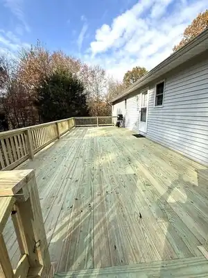 New wooden deck attached to white house in Murray KY